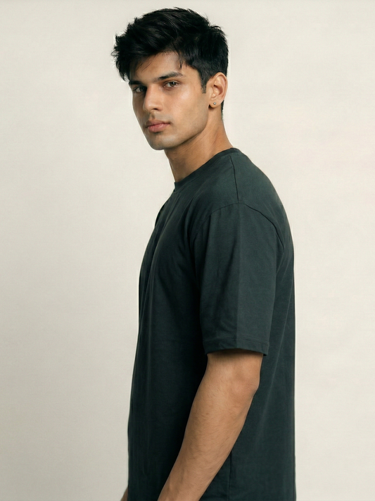 Man wearing a black t-shirt against a plain background